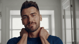 Man applying O My! After Shave Lotion to his face after a good clean shave.
