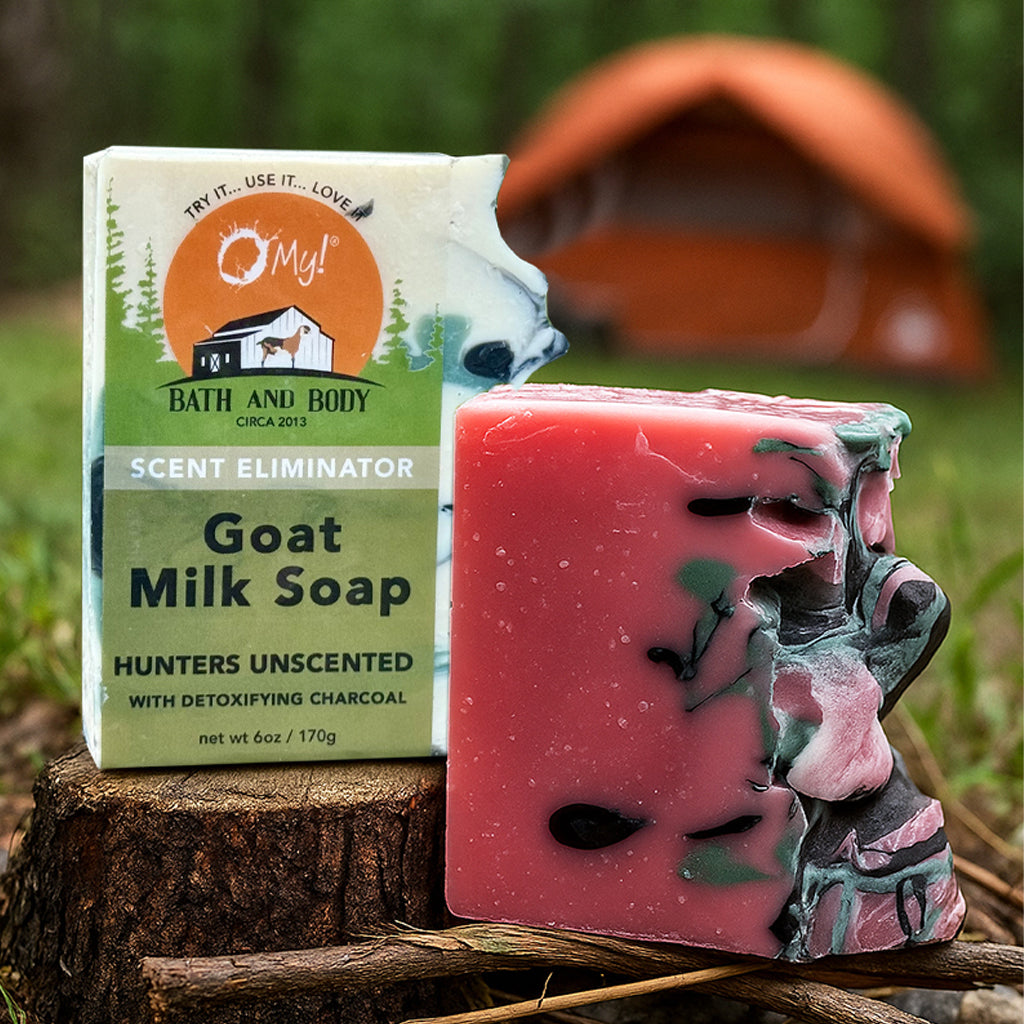 O My! Artisan Goat Milk Soaps for Hunter and Huntress with a tent in nature in the background.