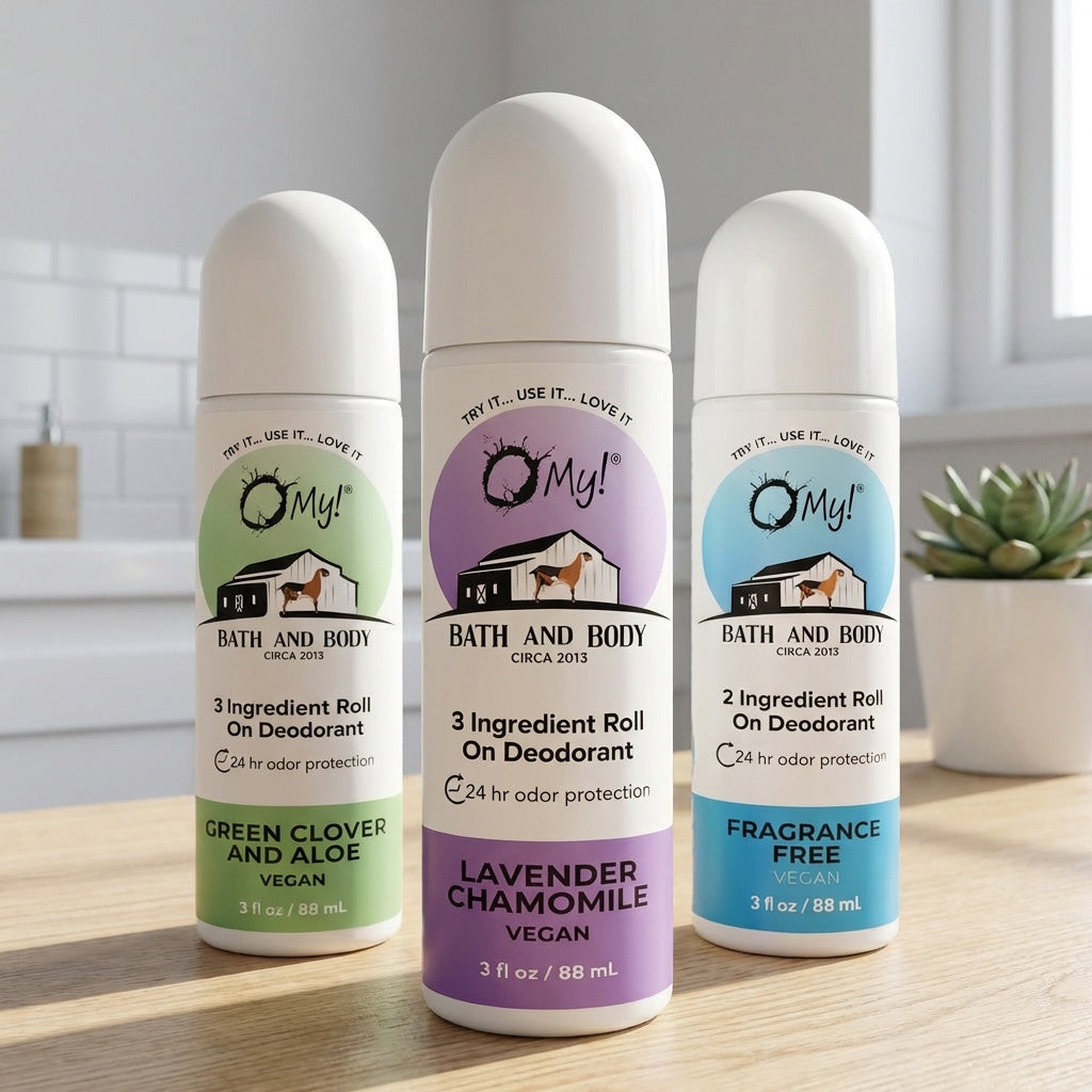 Three bottles of OMy! Bath and Body deodorants on a wooden surface with a neutral background.