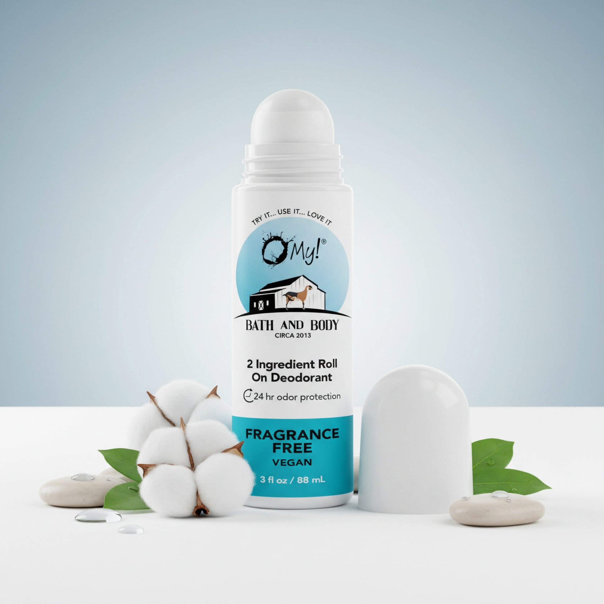 O My! Roll-on deodorant with cotton and mint leaves on a light gray background