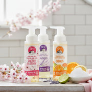 O My! Goat Milk Foaming Hand Wash in Cherry Blossom, Lavender, Citrus and Fragrance Free, sitting on a wood table in the kitchen.