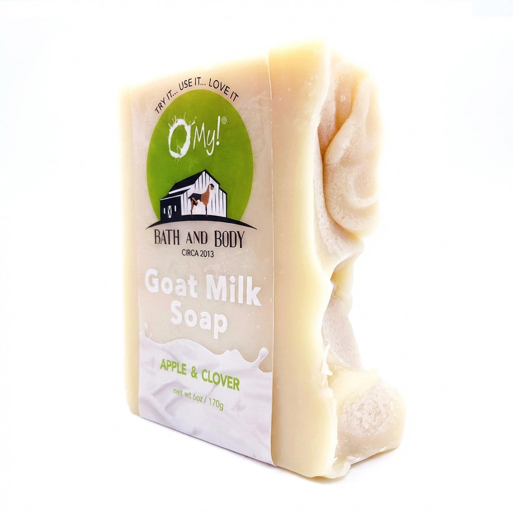 Bar of O My! goat milk soap with a clear label on a white background