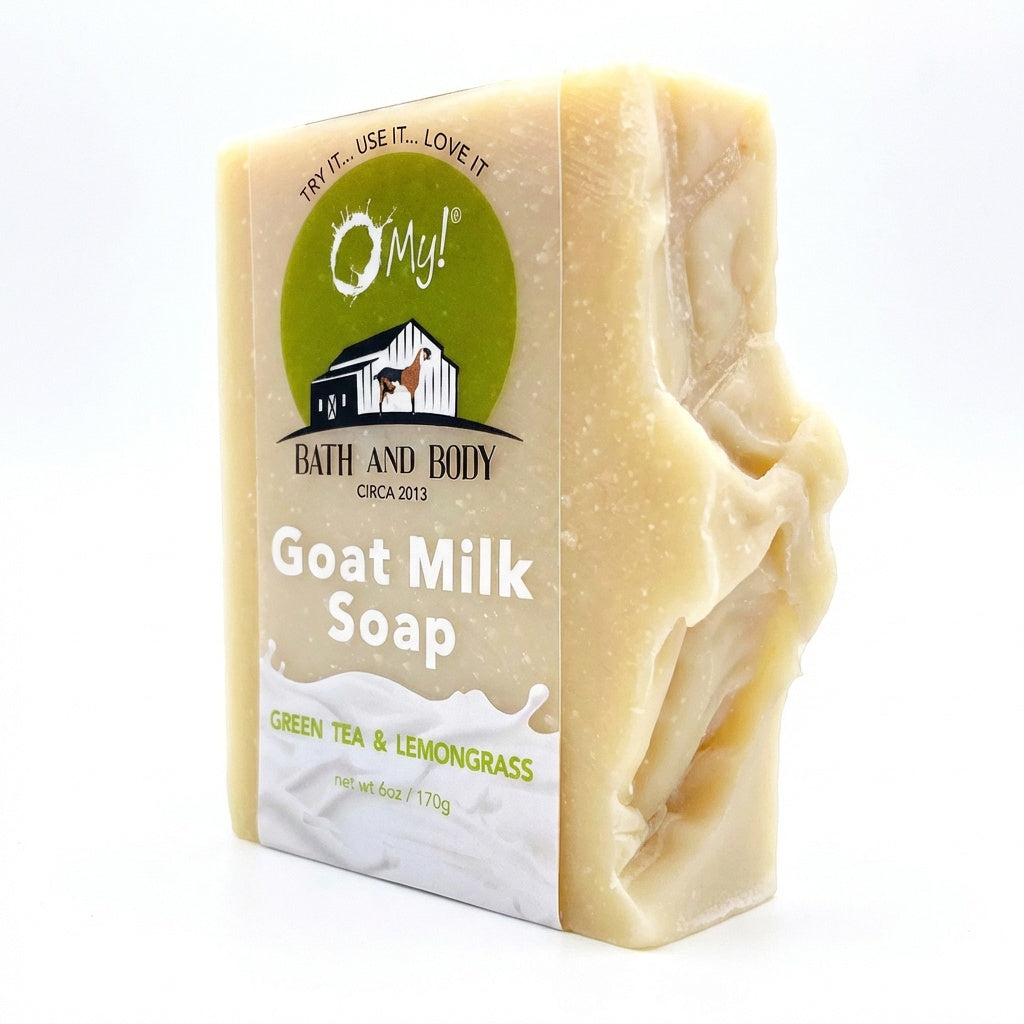 Bar of O My! goat milk soap with a clear label on a white background