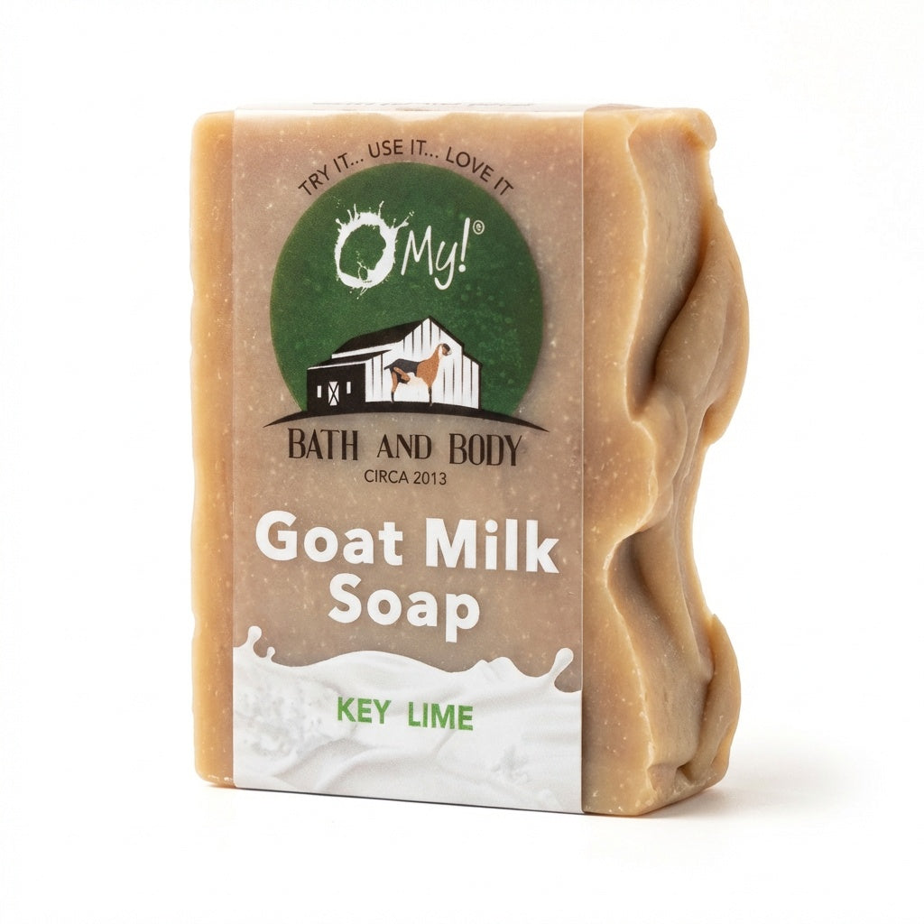 Bar of O My! goat milk soap with a clear label on a white background