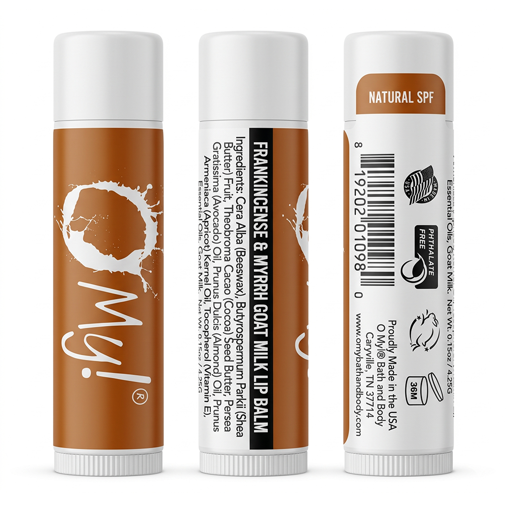 Three views of O My! Frankincense & Myrrh Goat Milk lip balm tubes on a white background