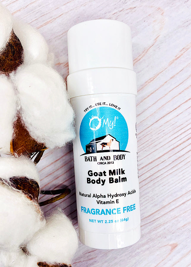 O My! Goat Milk Body Balm Fragrance Free on white wood background with soft white cotton beside it